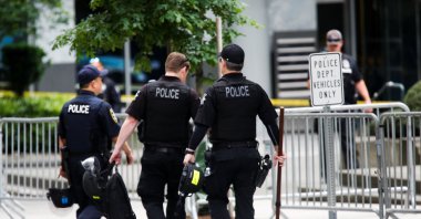 Seattle Police officers carry gear as they walk towards the Seattle Police Department's West Precinct in Seattle, Washington, U.S. June 10, 2020. (Reuters Photo)