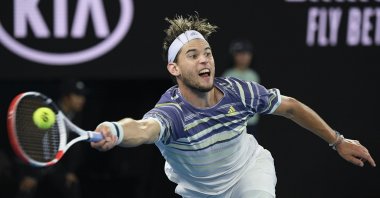 Dominic Thiem makes a forehand return to Novak Djokovic during the Australian Open tennis championship final in Melbourne, Australia, Feb. 2, 2020. (AP Photo)