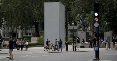 A protective screen put up late Thursday encloses the statue of Britain's World War II Prime Minister Winston Churchill ahead of expected rival demonstrations by anti-racism and far-right protesters in London, June 12, 2020. (AP Photo)
