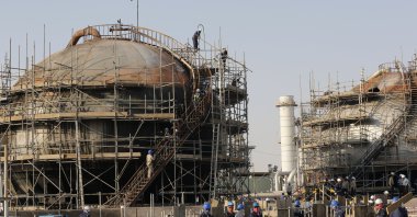 Workers fix the damage in Aramco's oil separator at processing facility after an attack in Abqaiq, Saudi Arabia, Sept. 20, 2019. (AP Photo) 