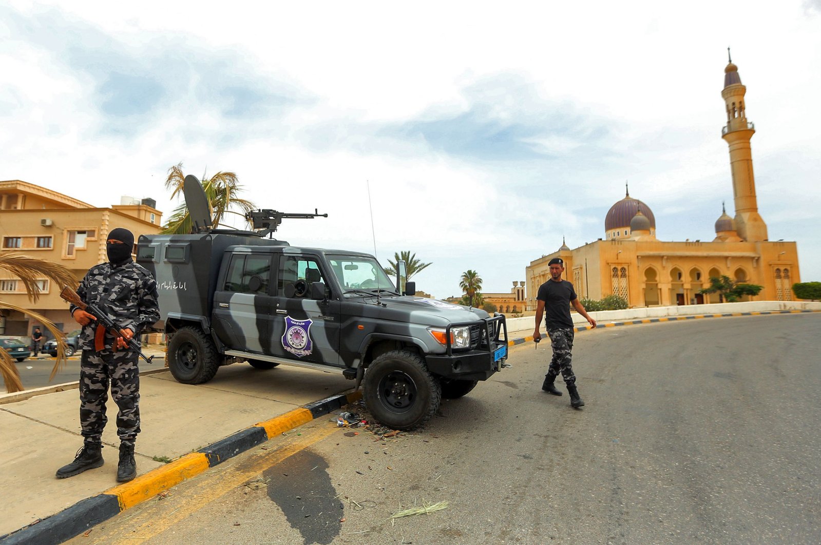 Members of security forces affiliated with the Libyan Government of National Accord's (GNA) Interior Ministry stand at a makeshift checkpoint in the town of Tarhuna, about 65 kilometers southeast of the capital Tripoli, Libya, June 11, 2020. (AFP Photo)