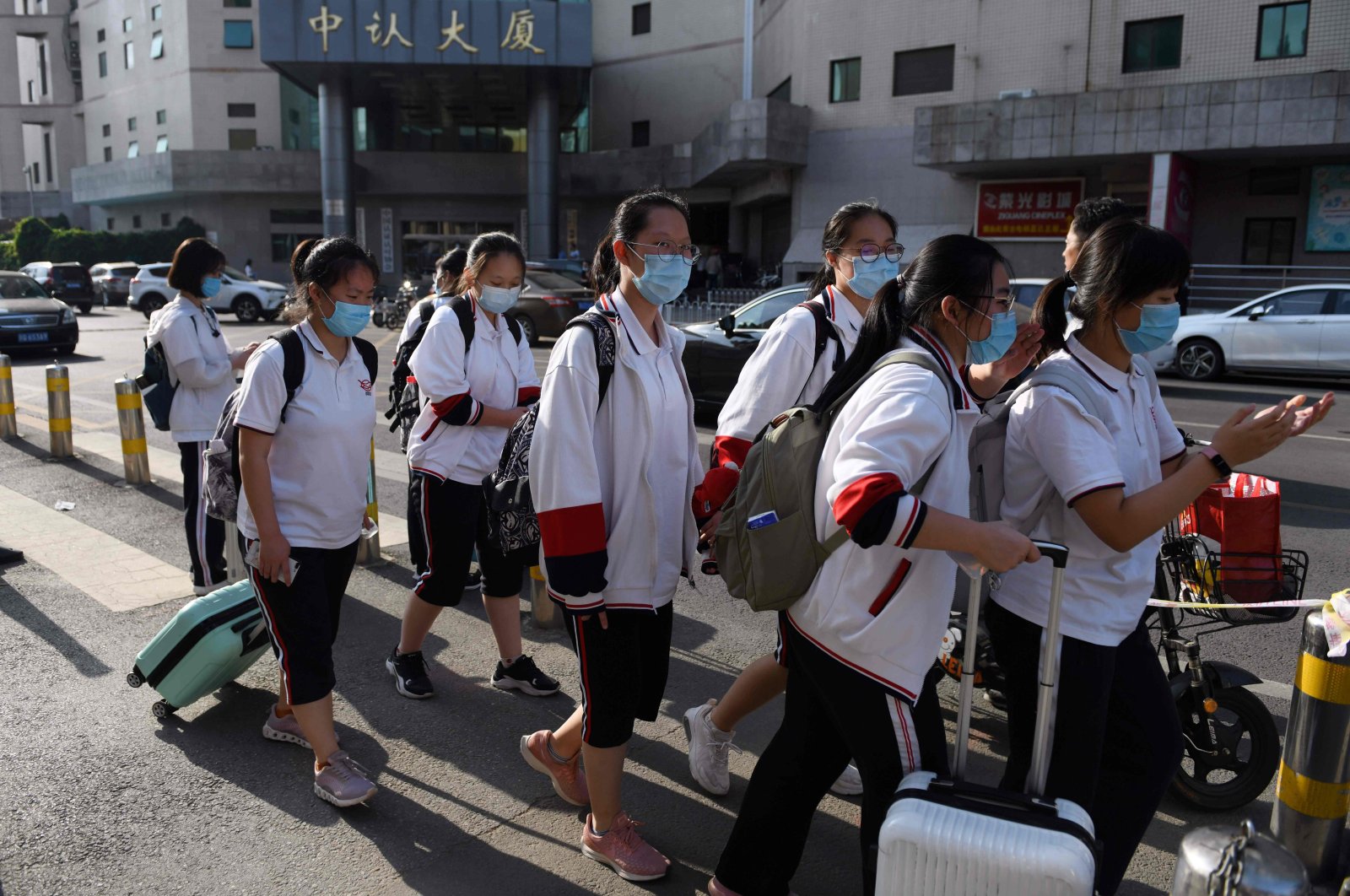 High school students leave at the end of their school day in Beijing, June 12, 2020. (AFP Photo)