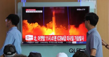 People watch a TV news program showing an image of North Korea's latest test launch of an intercontinental ballistic missile (ICBM), at the Seoul Railway Station in Seoul, South Korea, July 29, 2017. (AP Photo)
