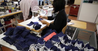 An employee sews face protective masks in Chanteclair Hosiery, a French knitwear clothing manufacturer in Saint Pouange, east of Paris, June 12, 2020. (AP Photo)