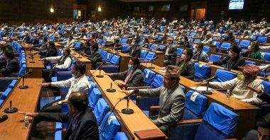 Nepal's House of Representatives members gesture as they vote on an amendment to update the national emblem with a new controversial political map in Kathmandu on June 13, 2020. (AFP Photo)
