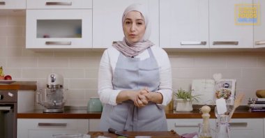 Libya’s Lubna Ben Halim preparing the seabass (YouTube Screengrab courtesy of International Mediterranean Gastronomy Festival)