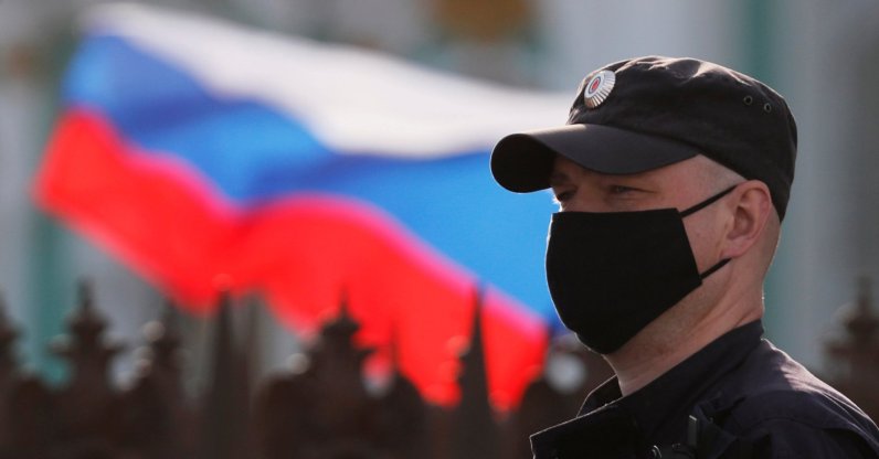 A police officer wearing a protective face mask stands guard at Dvortsovaya Square in Saint Petersburg, Russia June 12, 2020. (Reuters Photo)