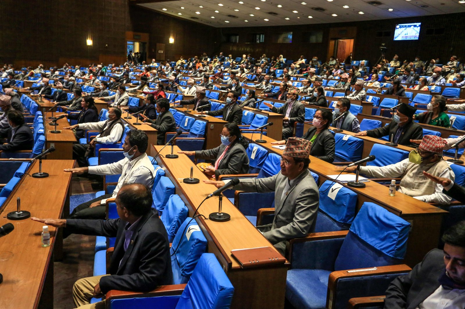 Nepal's House of Representatives members gesture as they vote on an amendment to update the national emblem with a new controversial political map in Kathmandu on June 13, 2020. (AFP Photo)