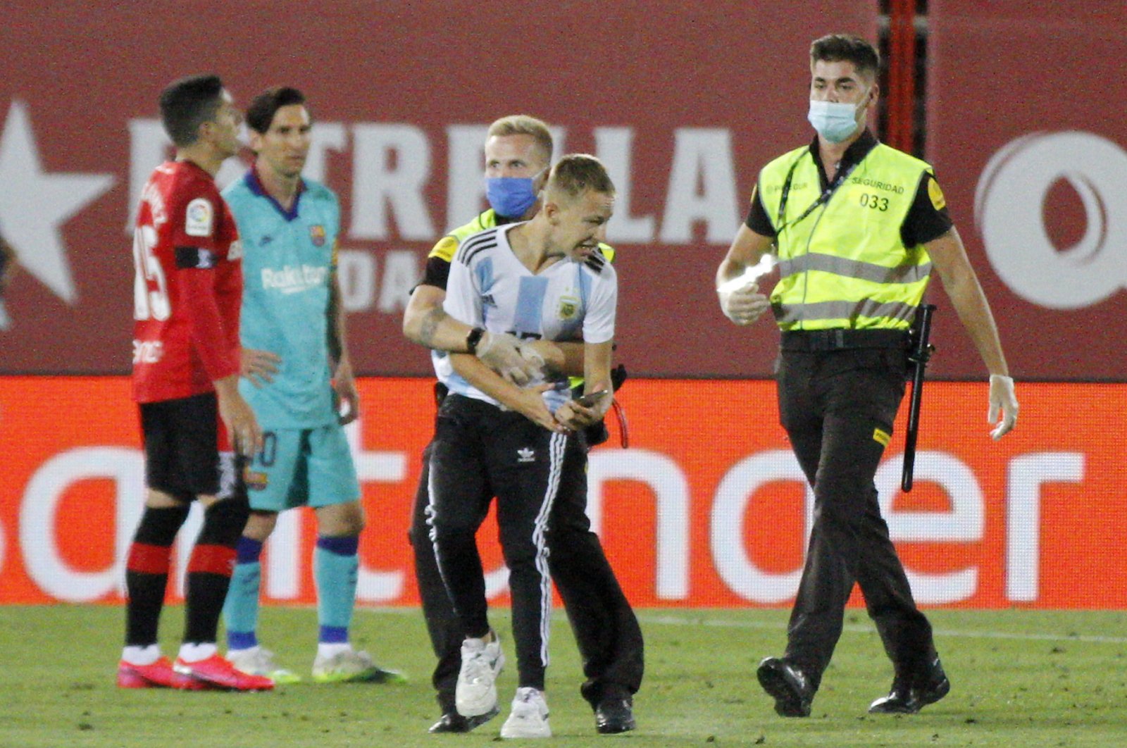 The fan was stopped by security forces, Mallorca, Spain, June 13, 2020. (AP Photo)