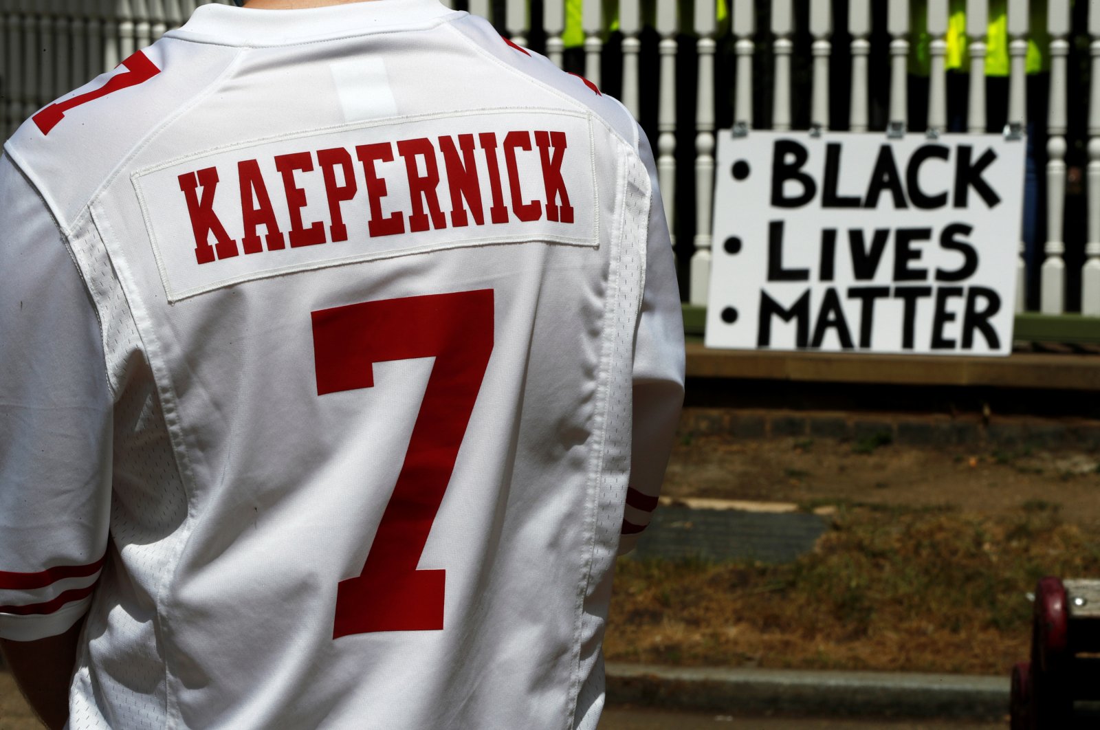 A man wears a jersey of former NFL quarterback Colin Kaepernick ahead of a Black Lives Matter protest in Forbury Gardens in Reading, Britain, June 13, 2020. (Reuters Photo)