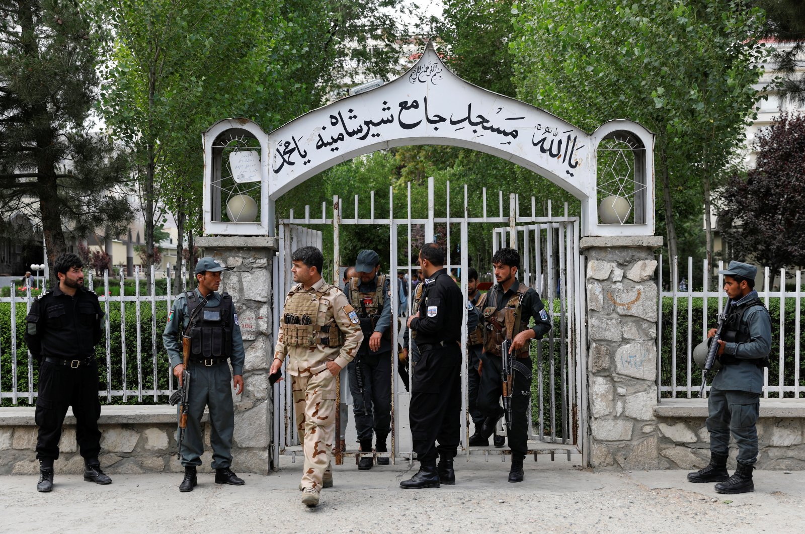 Afghan policemen inspect at the gate of a mosque after a blast in Kabul, Afghanistan, June 12, 2020. (Reuters Photo)