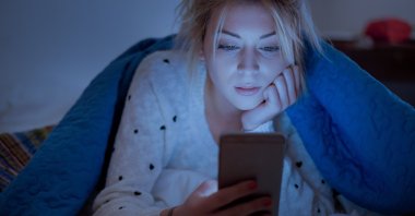 Almost half of the people surveyed said they used their phones in bed before sleep. (IHA Photo)