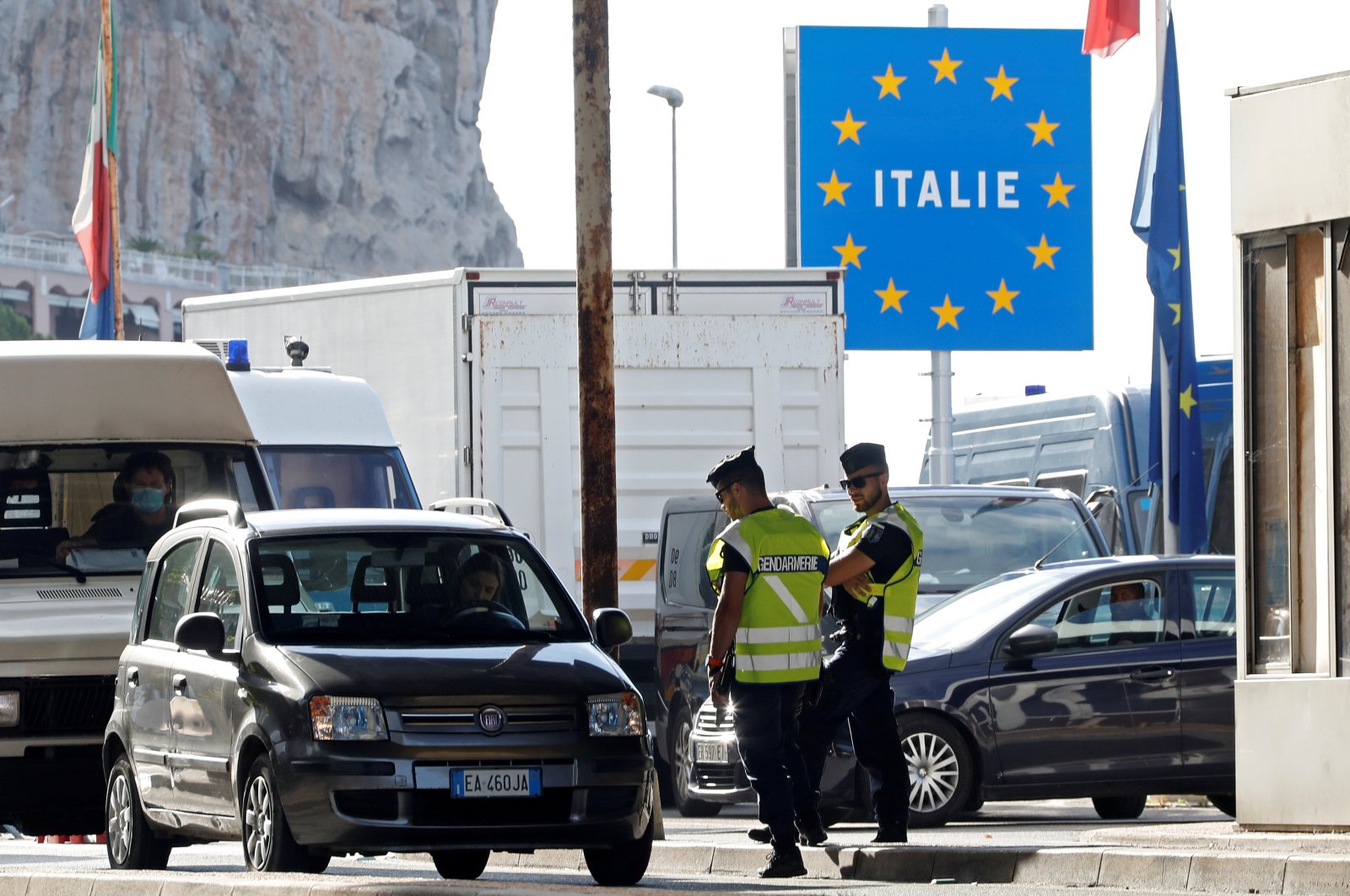 French gendarmes approach a car driver at the border check point Saint-Ludovic at the Franco-Italian border, after France reopened its border to Italians as COVID-19 travel restrictions across Europe are gradually eased, in Menton, France, June 15, 2020. (Reuters Photo)