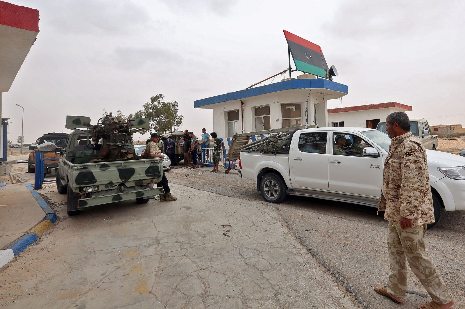 Vehicles of forces loyal to Libya's U.N.-recognized Government of National Accord (GNA) are seen outside a checkpoint at al-Watiya airbase, which they seized control of, southwest of the capital Tripoli, May 18, 2020. (AFP Photo)