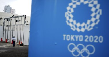 A lone security guard stands at one of the venues for the Tokyo 2020 Olympic Games in Tokyo, Japan, May 12, 2020. (AP Photo)