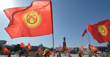 Kyrgyz dancers wave flags as they perform during the celebrations marking the 28th anniversary of Kyrgyzstan's independence from the Soviet Union at the Ala-Too square in Bishkek on August 31, 2019. (AFP Photo)
