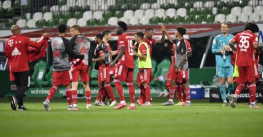 Bayern Munich's players celebrate end of the German Bundesliga football match between Werder Bremen and Bayern Munich in Bremen, Germany, Tuesday, June 16, 2020. (AP Photo)