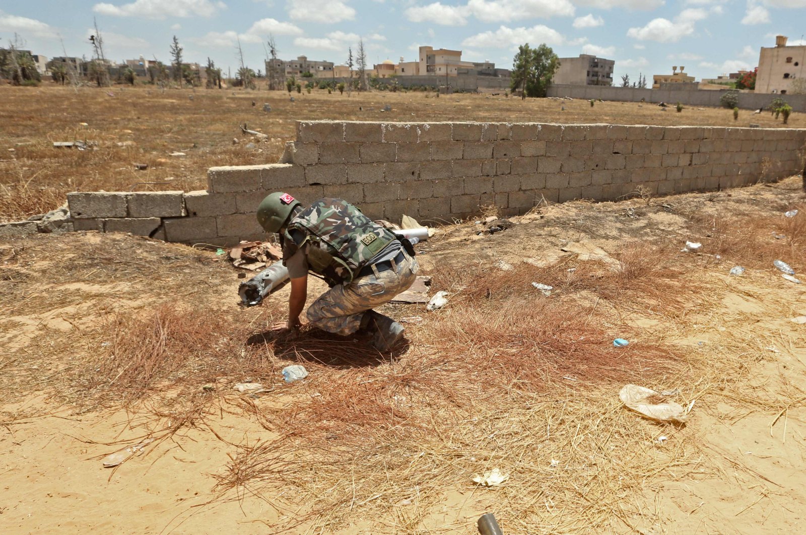 A Turkish de-miner takes part in the clearance of unexploded ordnance in the area of Salah al-Din, south of the Libyan capital Tripoli, June 15, 2020. (AFP Photo)