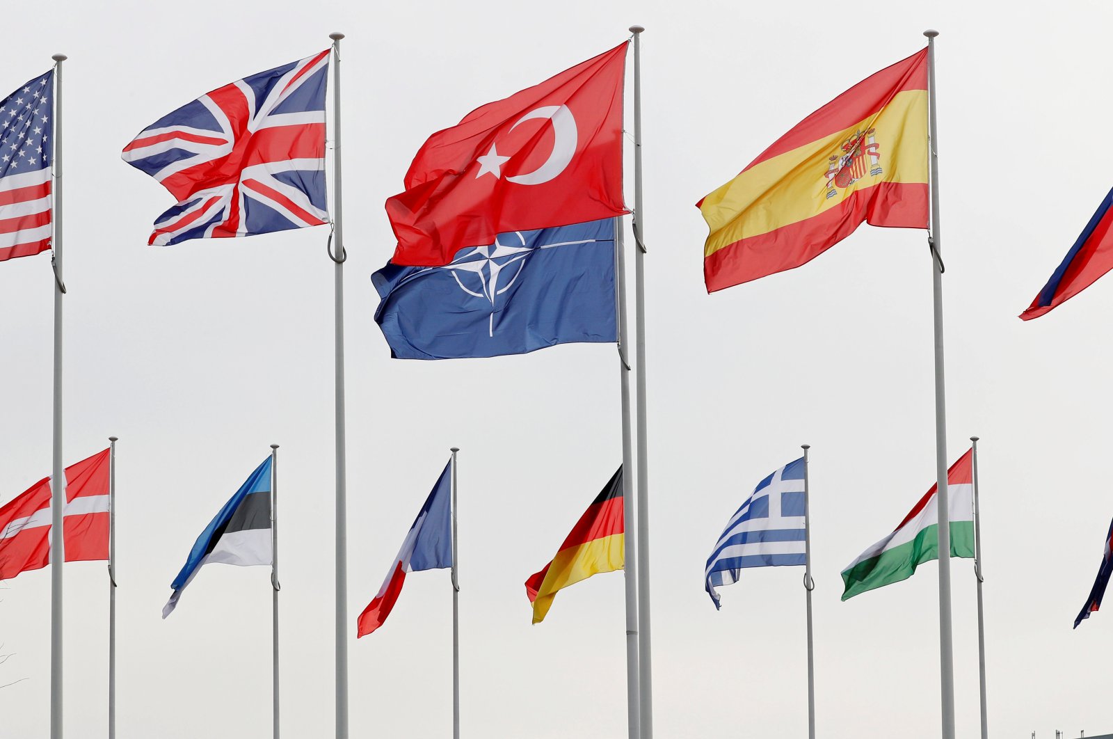 Flags of NATO member countries flutter at the alliance's headquarters in Brussels, Belgium, Feb. 28, 2020. (REUTERS Photo)