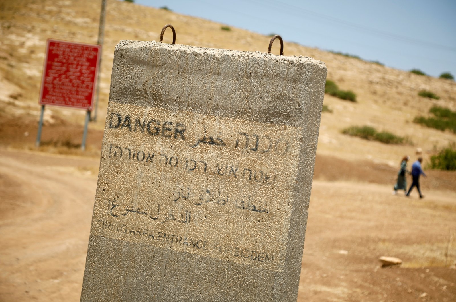 A concrete barrier with writings warning against entering into a firing area is seen in the Jordan Valley in the Israeli-occupied West Bank, Palestine, June 13, 2020. (Reuters Photo)