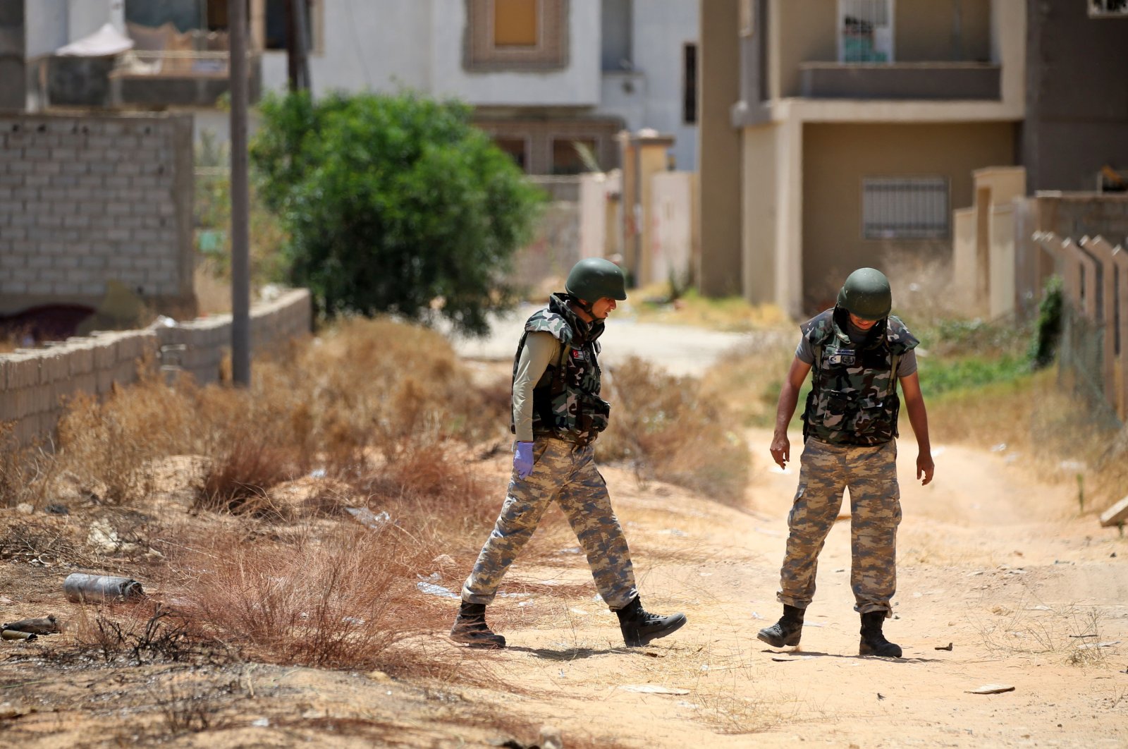 Turkish de-miners search and clear landmines in the area of Salah al-Din, south of the Libyan capital Tripoli, June 15, 2020. (AFP Photo)