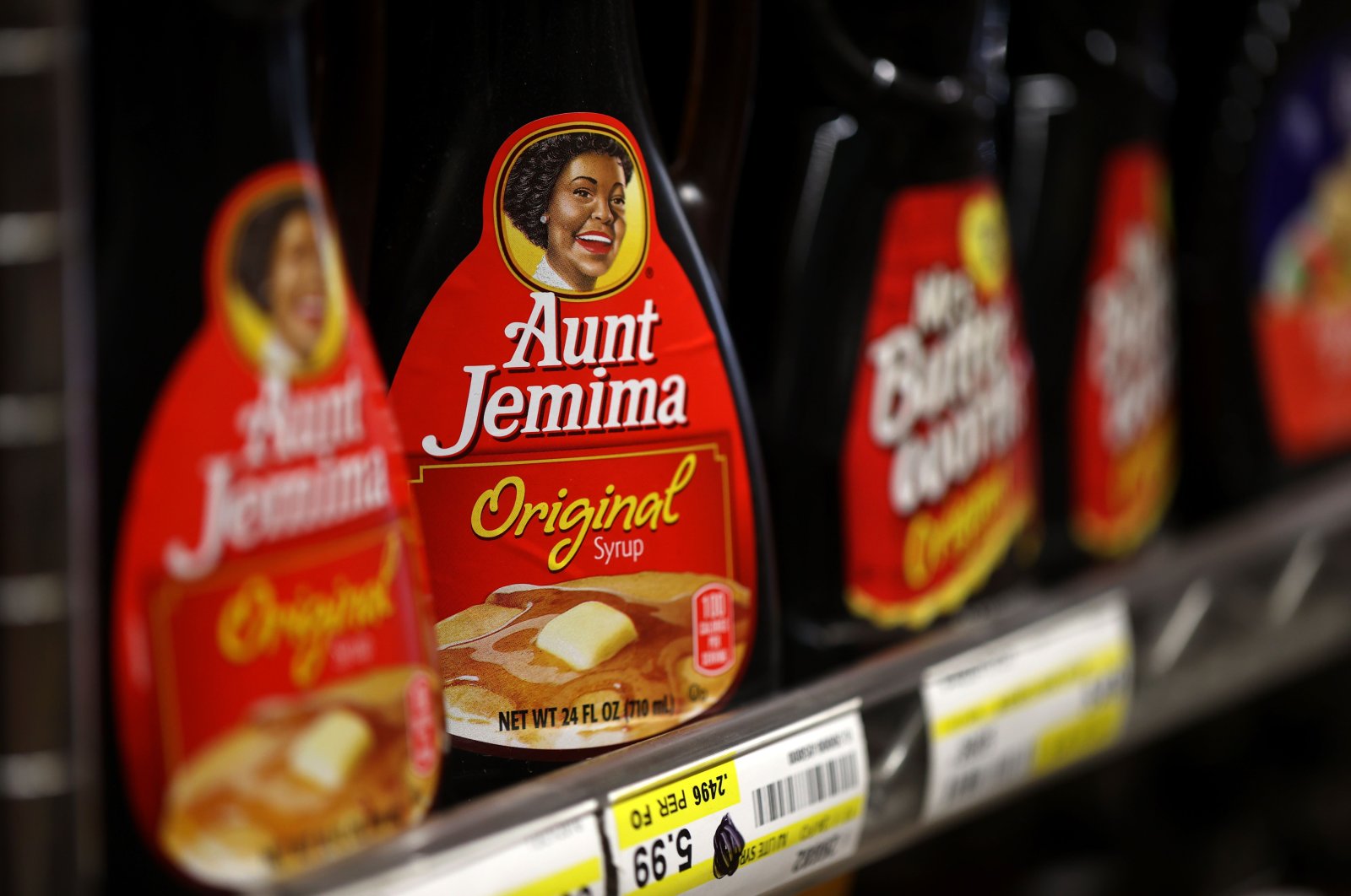 Bottles of Aunt Jemima pancake syrup are displayed on a shelf at Scotty&apo...