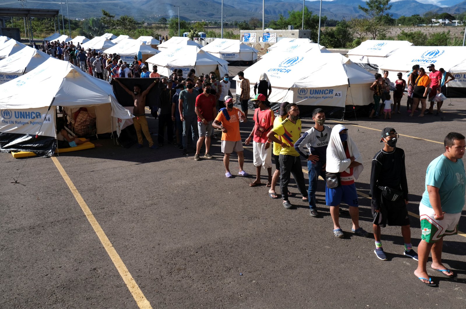 Venezuelan migrants stand in line at a health care center at the Venezuelan border, Cucuta, Colombia, June 16, 2020. (Reuters Photo)