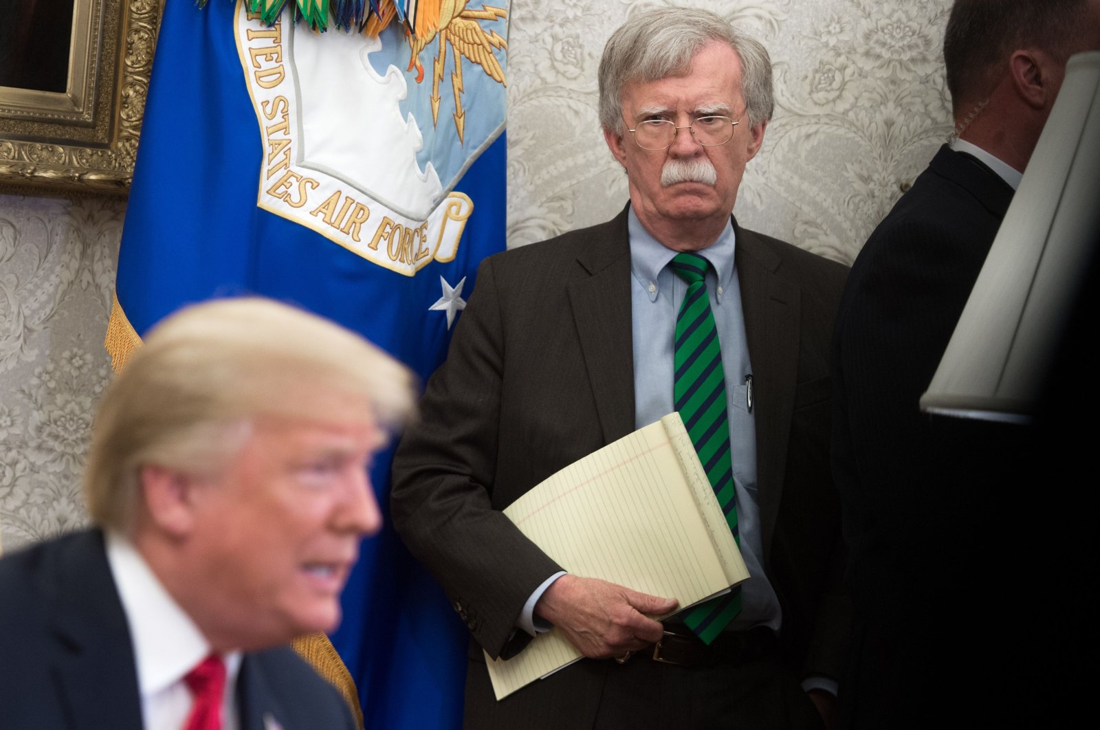 Former U.S. national security adviser John Bolton stands alongside President Donald Trump in the Oval Office of the White House, Washington, D.C., May 17, 2018. (AFP Photo)