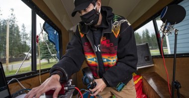 Artie Mendoza III, also known as KiidTruth, works on a new track in his home studio in Pablo, Montana, June 16, 2020. (AP Photo)