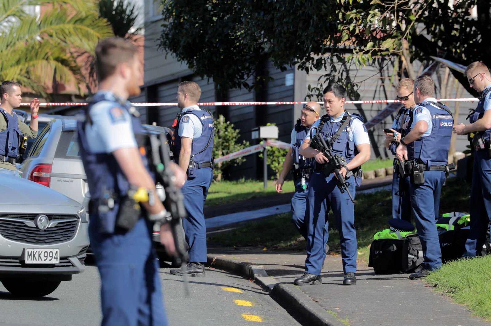 Armed police gather at the scene of a shooting incident following a routine traffic stop, Auckland, New Zealand, June 19, 2020. (AP Photo)
