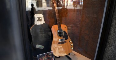 The guitar used by musician Kurt Cobain during Nirvana's famous MTV Unplugged in New York concert in 1993, is displayed in the window of the Hard Rock Cafe Piccadilly Circus in central London, England, May 15, 2020. (AFP Photo)