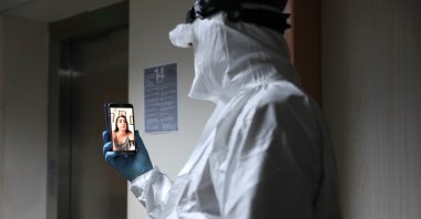 Doctor Mert Aydın talks to his daughter via videocall, in Izmir, Turkey, June 21, 2020. (AA Photo)