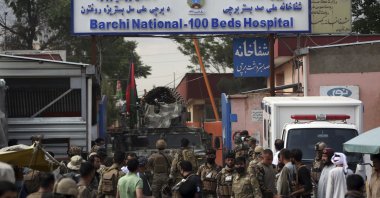 Afghan security officers stand in front of a maternity hospital, Kabul, May 12, 2020. (AP Photo)
