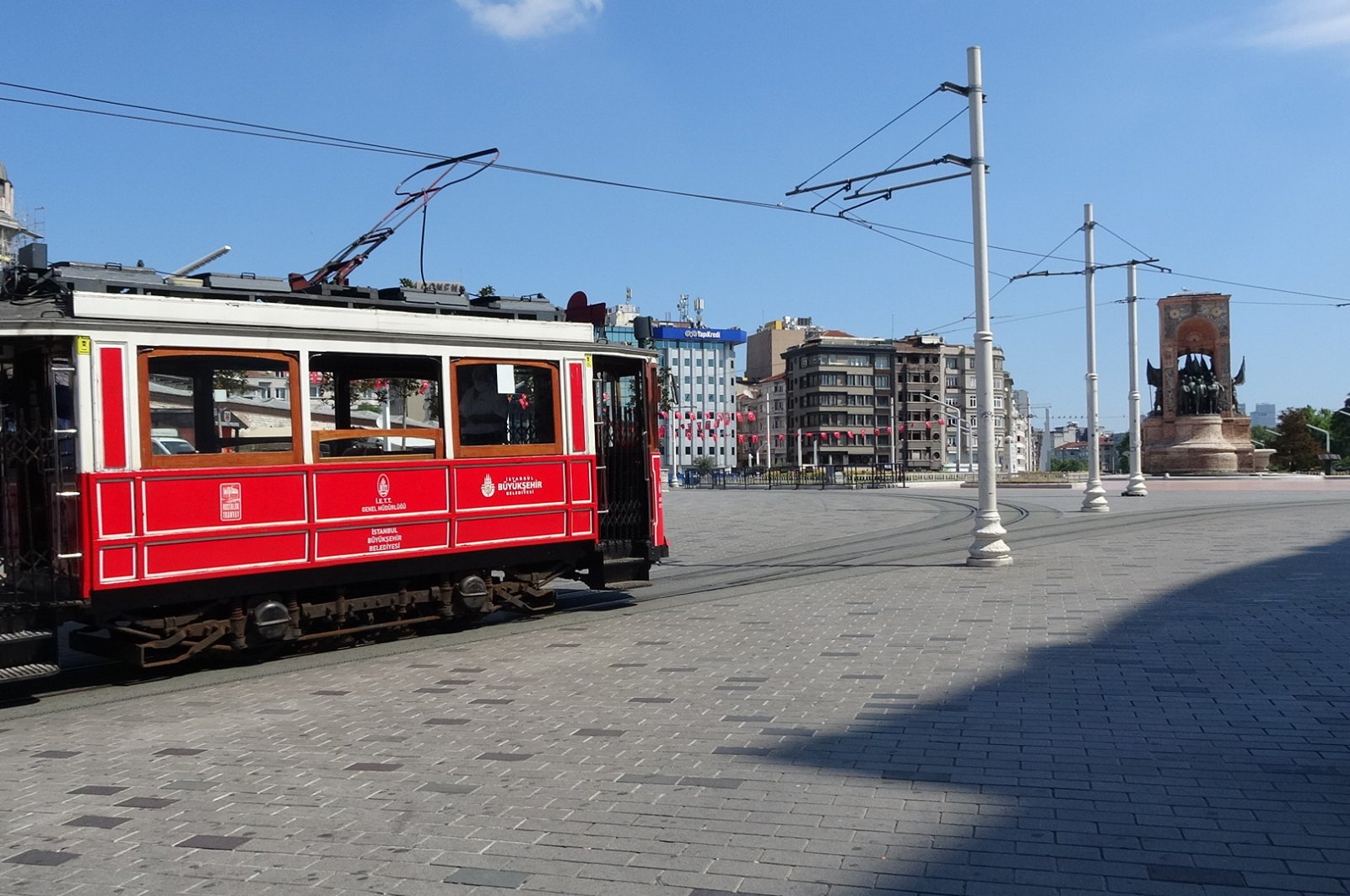 Istanbul's famous Taksim Square is seen relatively empty due to a curfew imposed during high school entrance exams,Turkey, June 20, 2020. (DHA Photo)