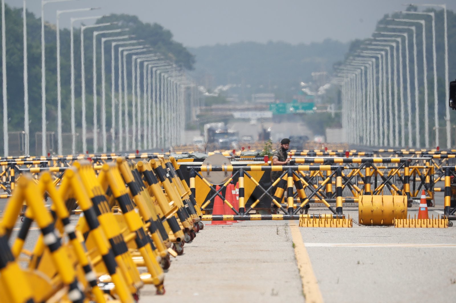 A soldier stands guard at a checkpoint on the Grand Unification Bridge, which leads to the inter-Korean Kaesong Industrial Complex in North Korea, just south of the demilitarized zone separating the two Koreas, in Paju, South Korea, June 17, 2020. (Reuters File Photo)