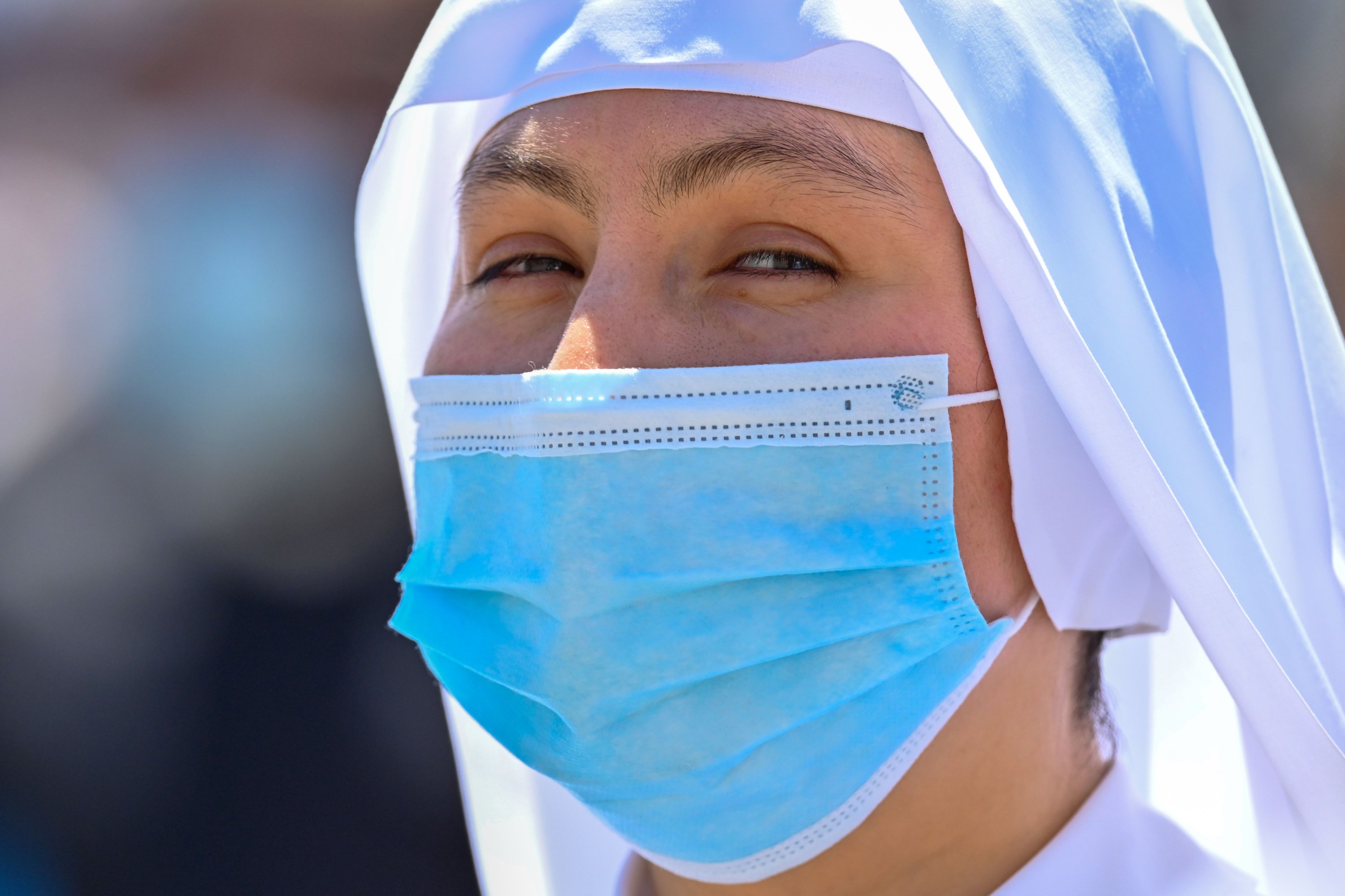 A nun wearing a face mask attends the pope's weekly Angelus prayer at St. Peter's Square in the Vatican, June 21, 2020. (AFP Photo)