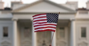 A flag is waved outside the White House, in Washington D.C., Sept. 5, 2017. (AP Photo) 