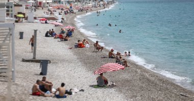 Tourists enjoy the sun at a beach in Antalya, a popular holiday resort in southern Turkey, June 23, 2020. (AA Photo)