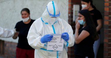 A member of a mobile testing unit of the German Army and German Red Cross is seen after testing residents for the coronavirus disease, Guetersloh, Germany, June 22, 2020. (Reuters Photo)