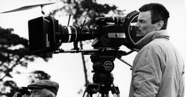 An undated photo showing Tarkovsky behind a camera during a filming. (Courtesy of Pera Museum)