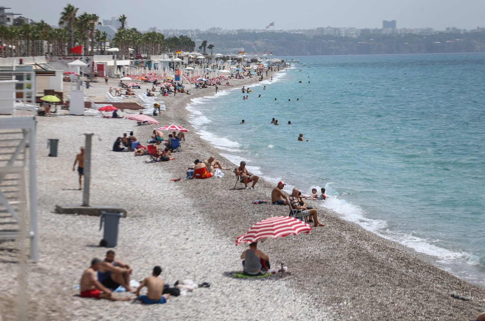 Tourists enjoy the sun at a beach in Antalya, a popular holiday resort in southern Turkey, June 23, 2020. (AA Photo)