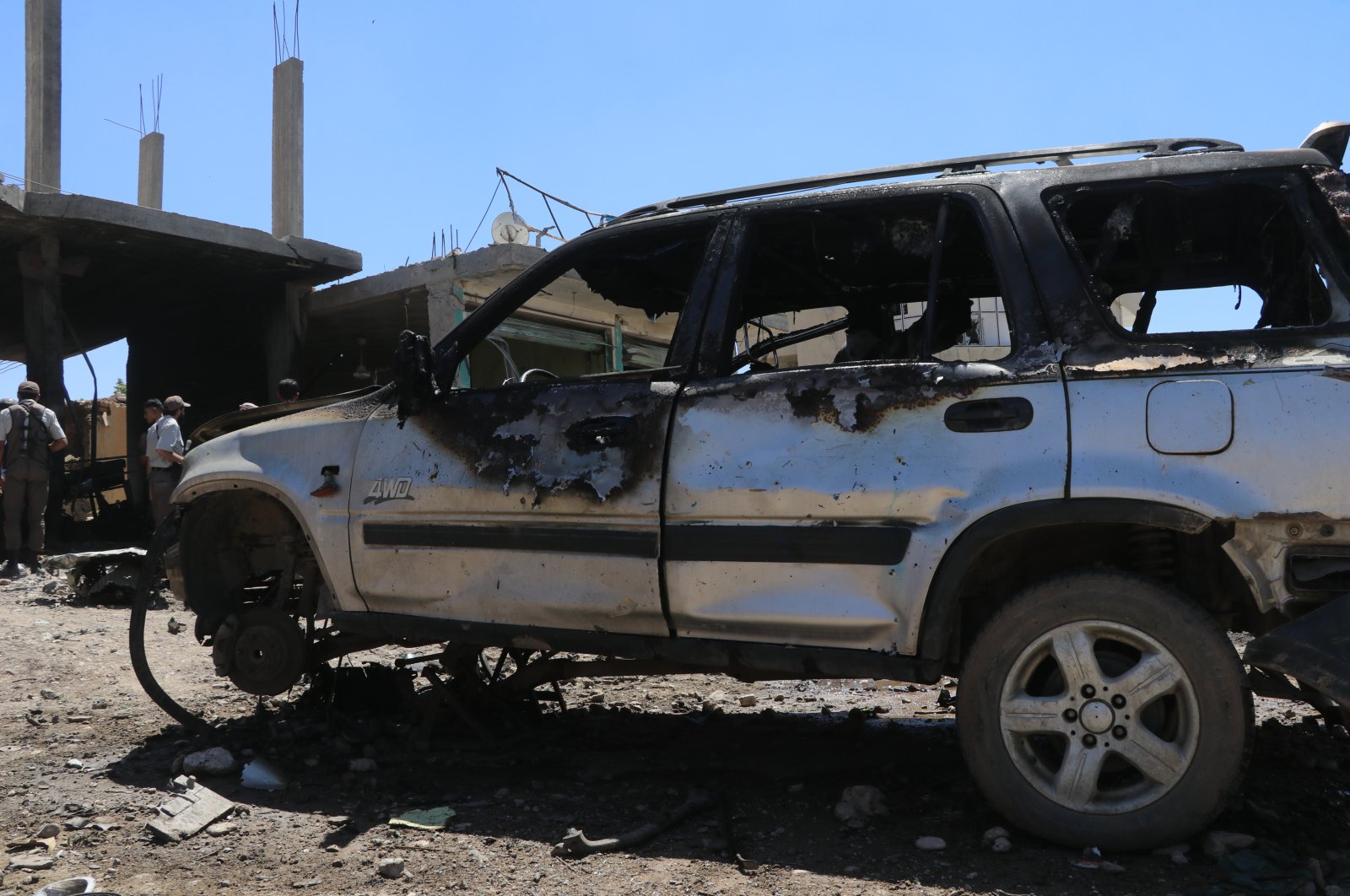 A car damaged by a YPG/PKK terrorist attack in Syria’s Tal Hafar, June 23, 2020. (AA Photo)