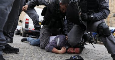Israeli police officers detain a Palestinian protestor during scuffles outside the compound housing al-Aqsa Mosque in Jerusalem's Old City, March 12, 2019. (Reuters Photo)
