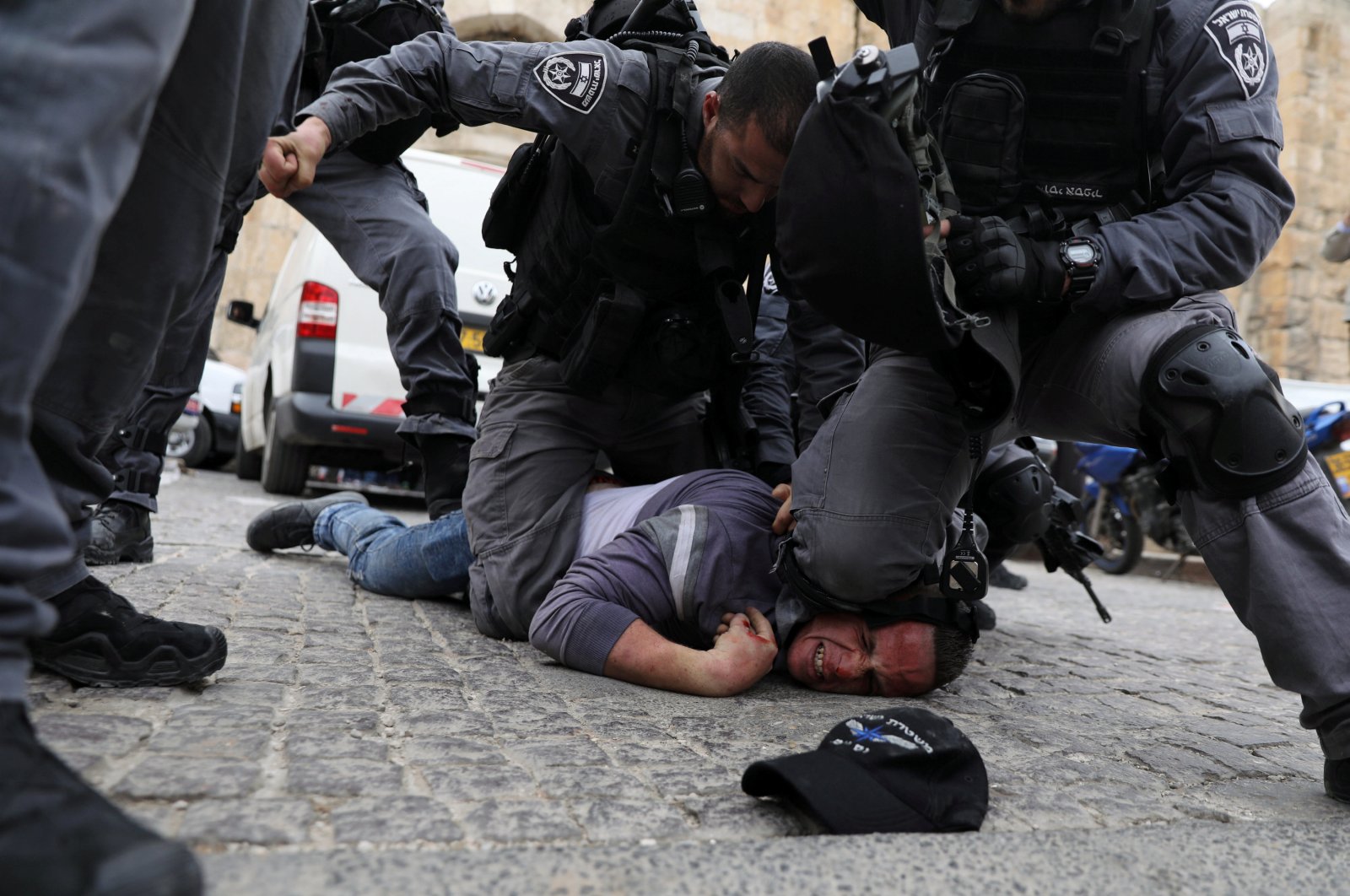 Israeli police officers detain a Palestinian protestor during scuffles outside the compound housing al-Aqsa Mosque in Jerusalem's Old City, March 12, 2019. (Reuters Photo)