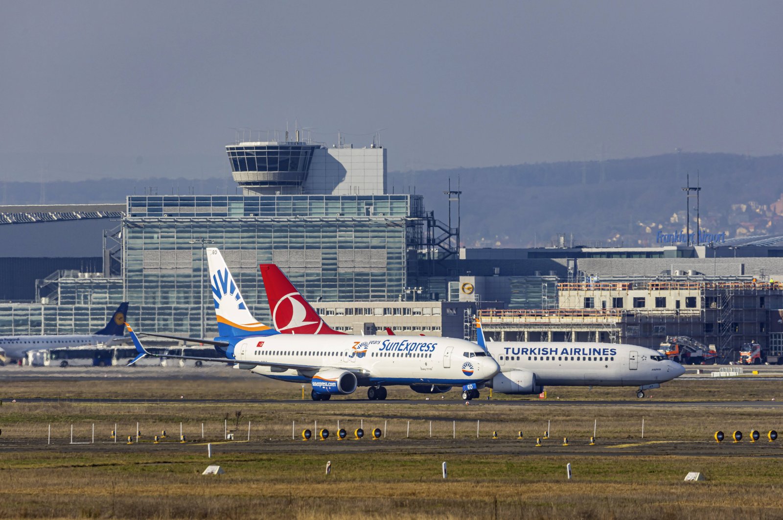 A SunExpress aircraft is seen beside a Turkish Airlines plane at Frankfurt Airport, Germany, Feb. 7, 2020. (Reuters Photo)