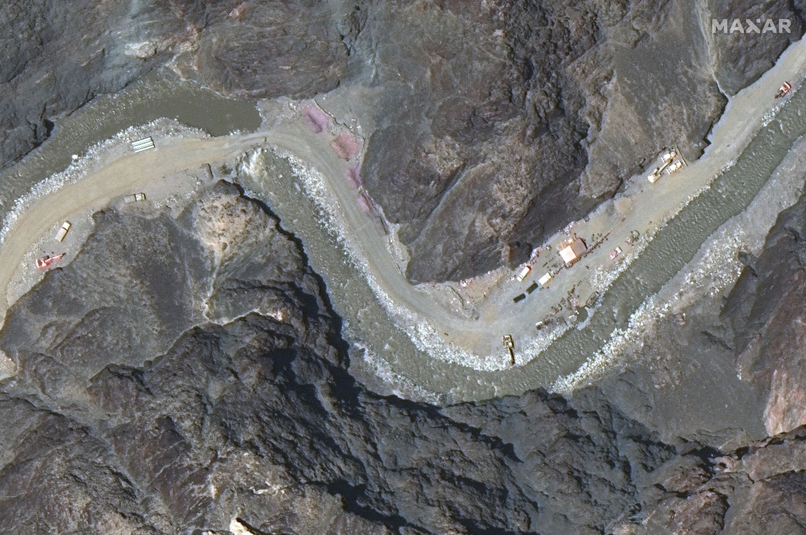 A satellite image provided by Maxar Technologies shows a road under construction near the Line of Actual Control, the border between India and China, June 22, 2020.  (Maxar Technologies via AP)