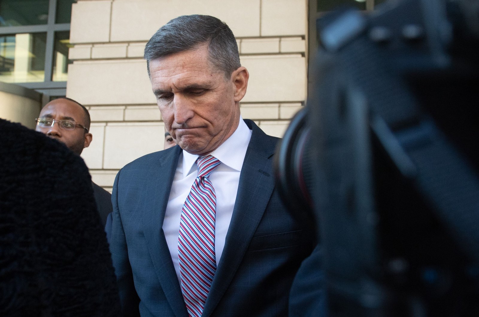Former National Security Advisor General Michael Flynn leaves after the delay in his sentencing hearing at U.S. District Court, Washington, D.C., Dec. 18, 2018. (AFP Photo)