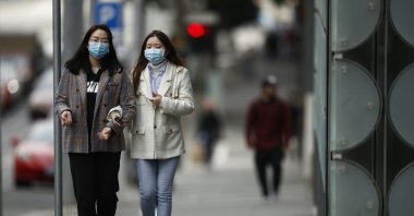 Women wearing masks walk around Melbourne, Australia, June 25, 2020. (EPA Photo)