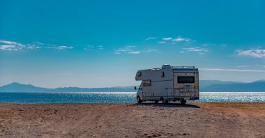 Park your car or caravan in the designated camping areas and then go for a swim in Ayvalık. (Shutterstock Photo)