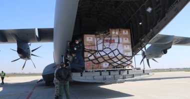 A military cargo plane carrying medical equipment from Turkey to Serbia lands in the Serbian capital Belgrad, April 10, 2020. (AA Photo)